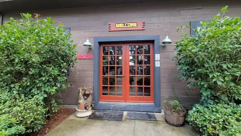 Office door with a WELCOME sign beside it
